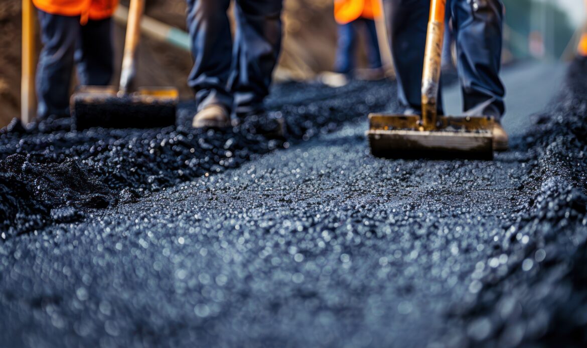 road construction workers teamwork background Asfalt Uygulamalarında İş Güvenliği Standartları | Güven Asfalt